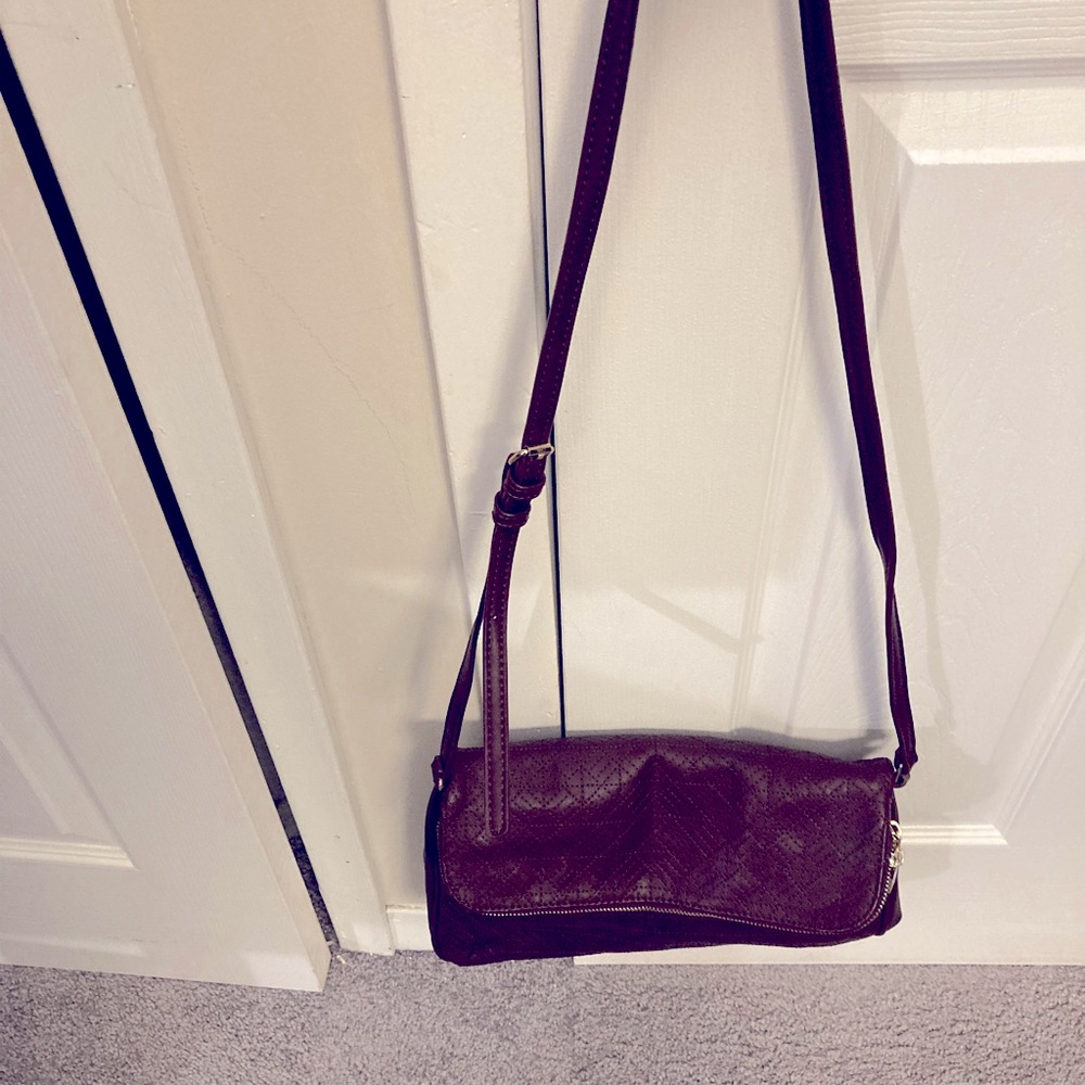 Burgundy adjustable cross body bag.